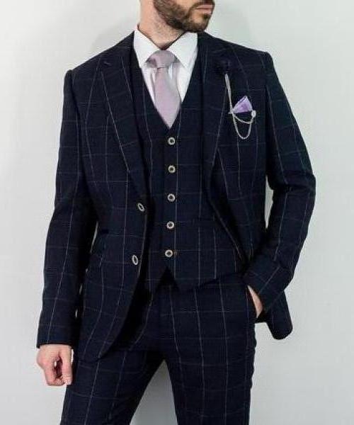 Angels Navy Check Three Piece Suit 
£224.99 GBP
Cut to a sleek slim fit with a tonal windowpane check, our stunning tweed Angels suit is the perfect winter three piece for a stylish gentleman. 
purchase for £199.99

Style-Angels 
Material-70% Polyester 30% Wool
Colour-Navy Check
Fitting-Slim Fit
Buttons-2
Internal pockets -2